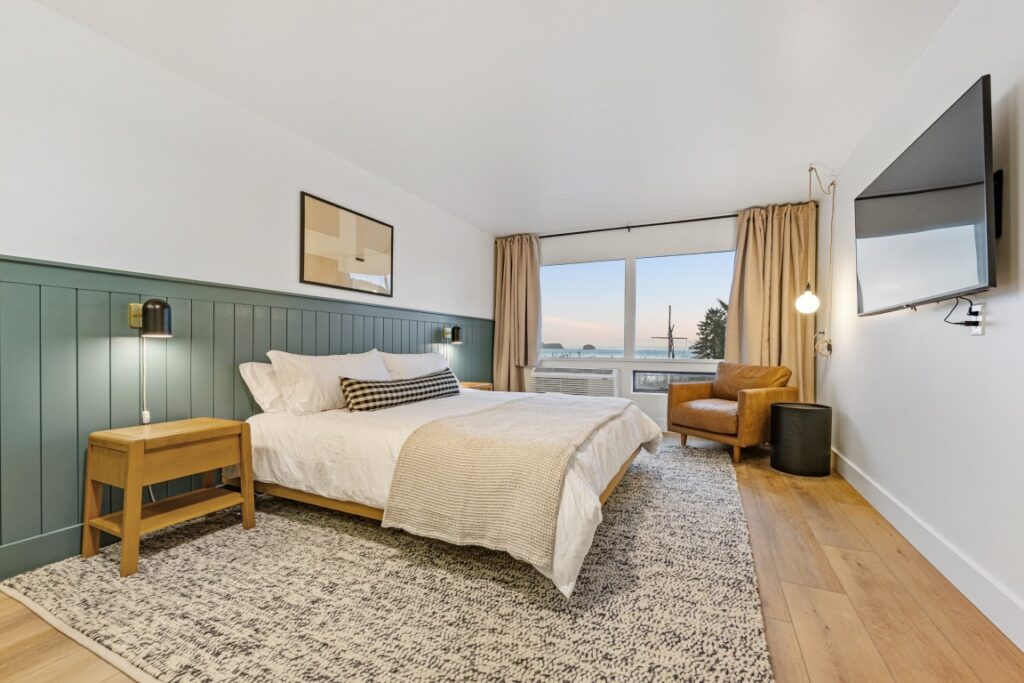 Modern bedroom with ocean view and cozy decor