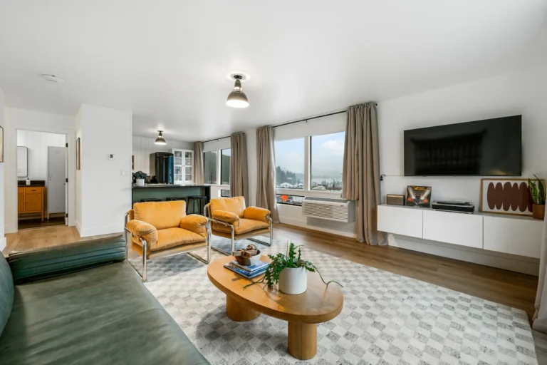 Modern living room with large windows and decor