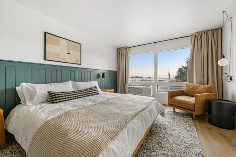 Modern bedroom with ocean view and cozy decor