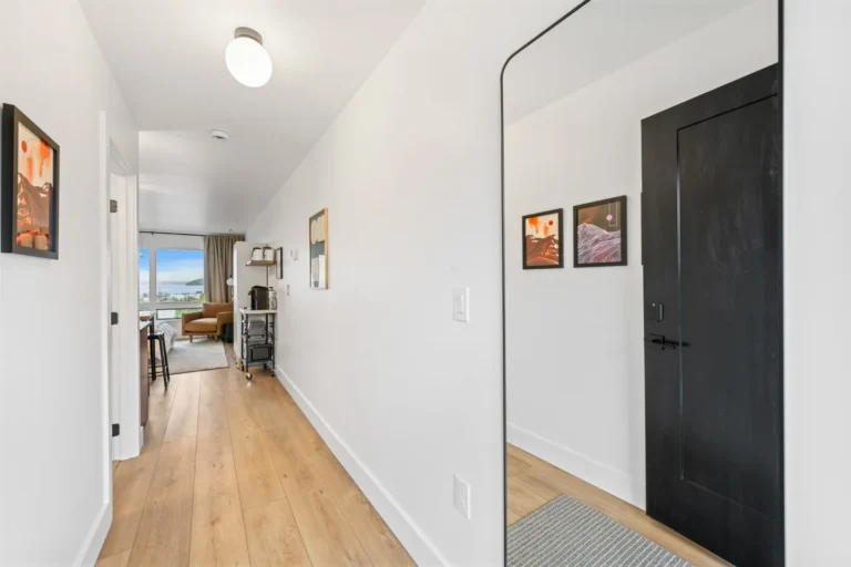 Modern hallway leading to bright living room