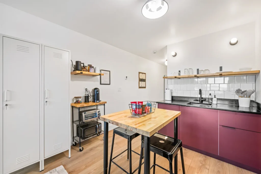 Modern kitchen with purple cabinets and wooden island