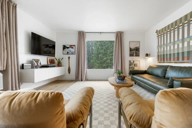 Modern living room with green sofa and TV