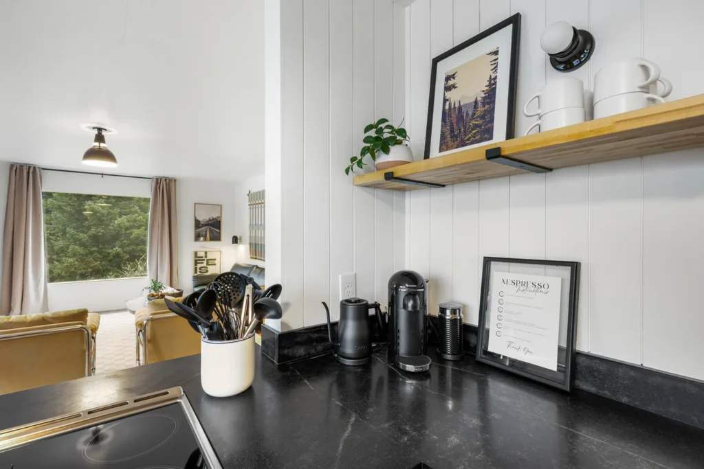 Modern kitchen counter with coffee maker and utensils