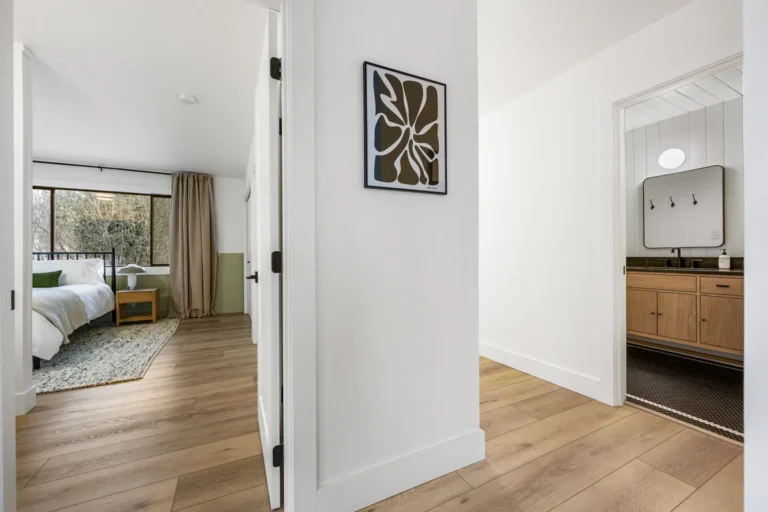 Modern hallway leading to bedroom and bathroom