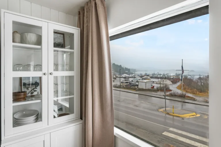 Kitchen cabinet beside large window with street view
