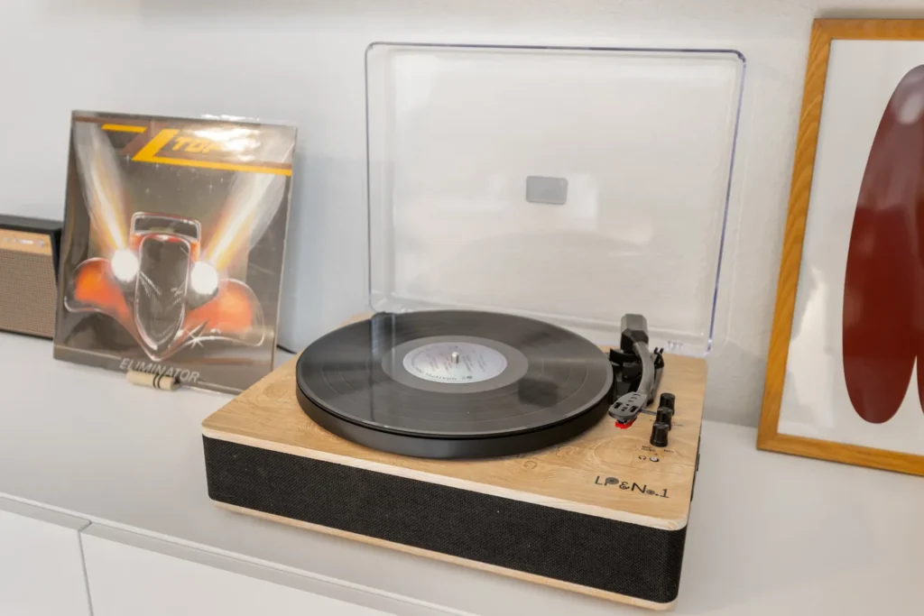 Wood record player with vinyl and album cover
