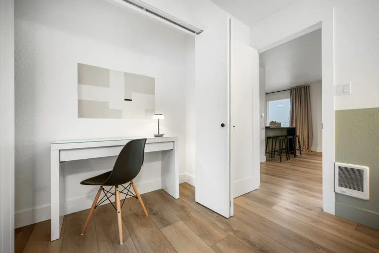 Minimalist home office with white desk and chair