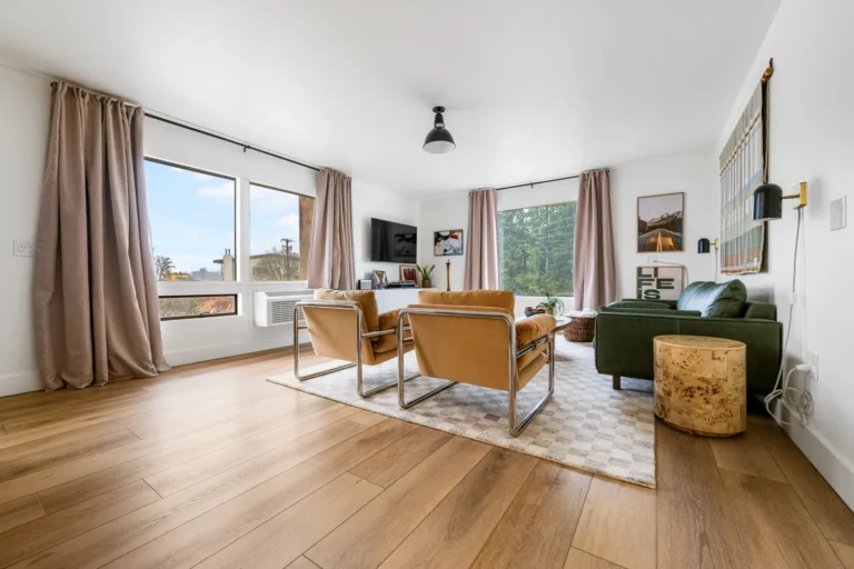 Modern living room with large windows and sofas