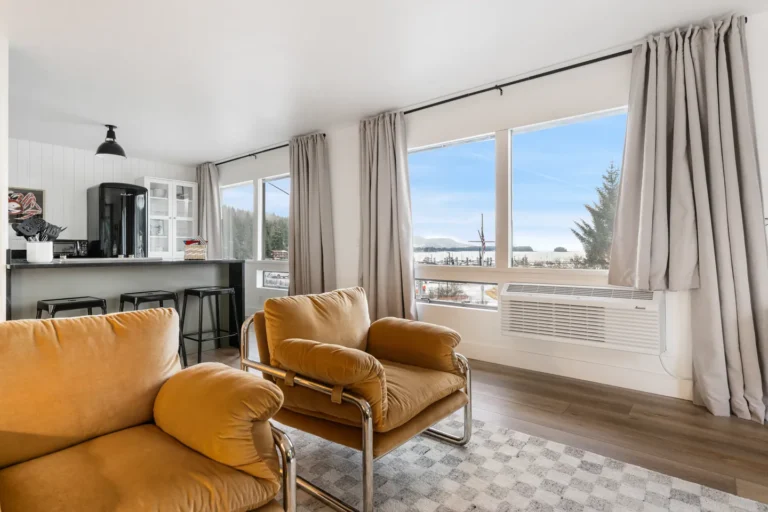 Modern living room with ocean view and cozy chairs