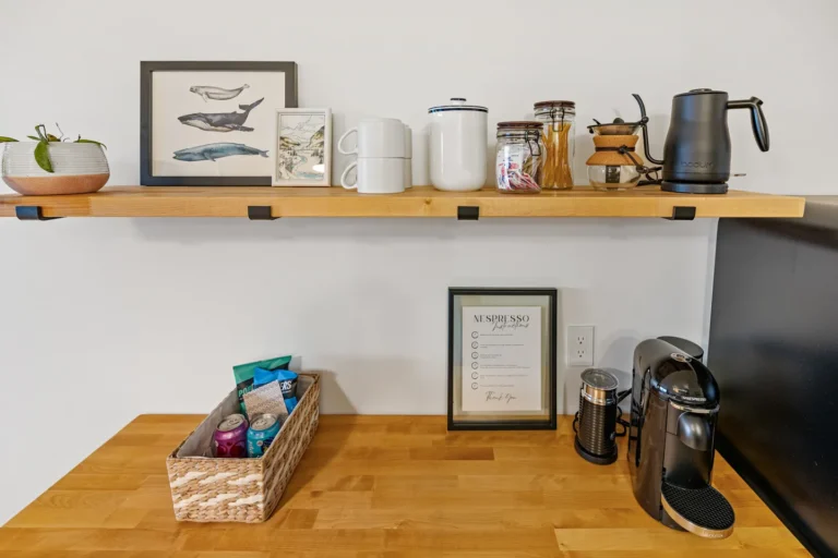 Modern coffee station with mugs and espresso machine