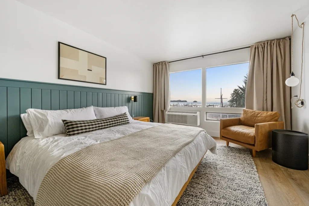 Modern bedroom with ocean view and cozy decor