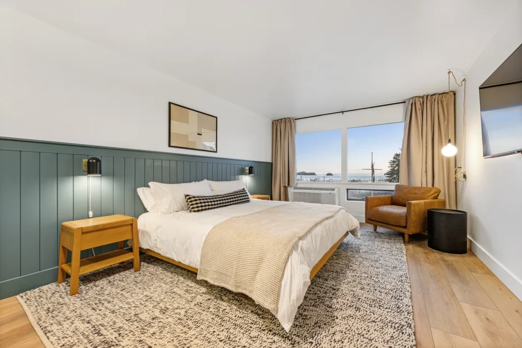 Modern bedroom with ocean view and cozy decor