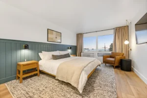 Modern bedroom with ocean view and cozy decor