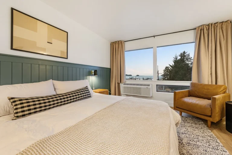 Cozy bedroom with ocean view window