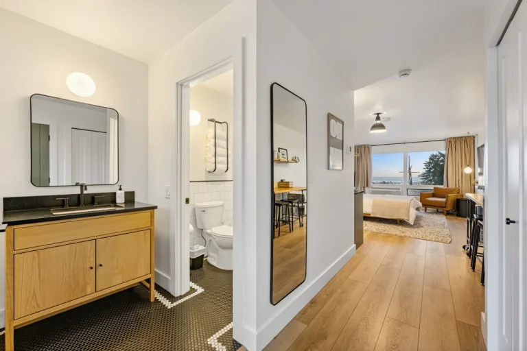 Modern studio apartment with bathroom and bedroom view