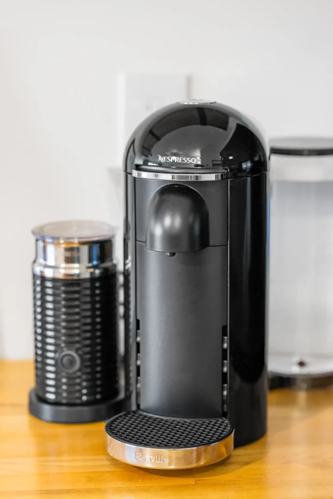 Black Nespresso coffee machine on kitchen counter