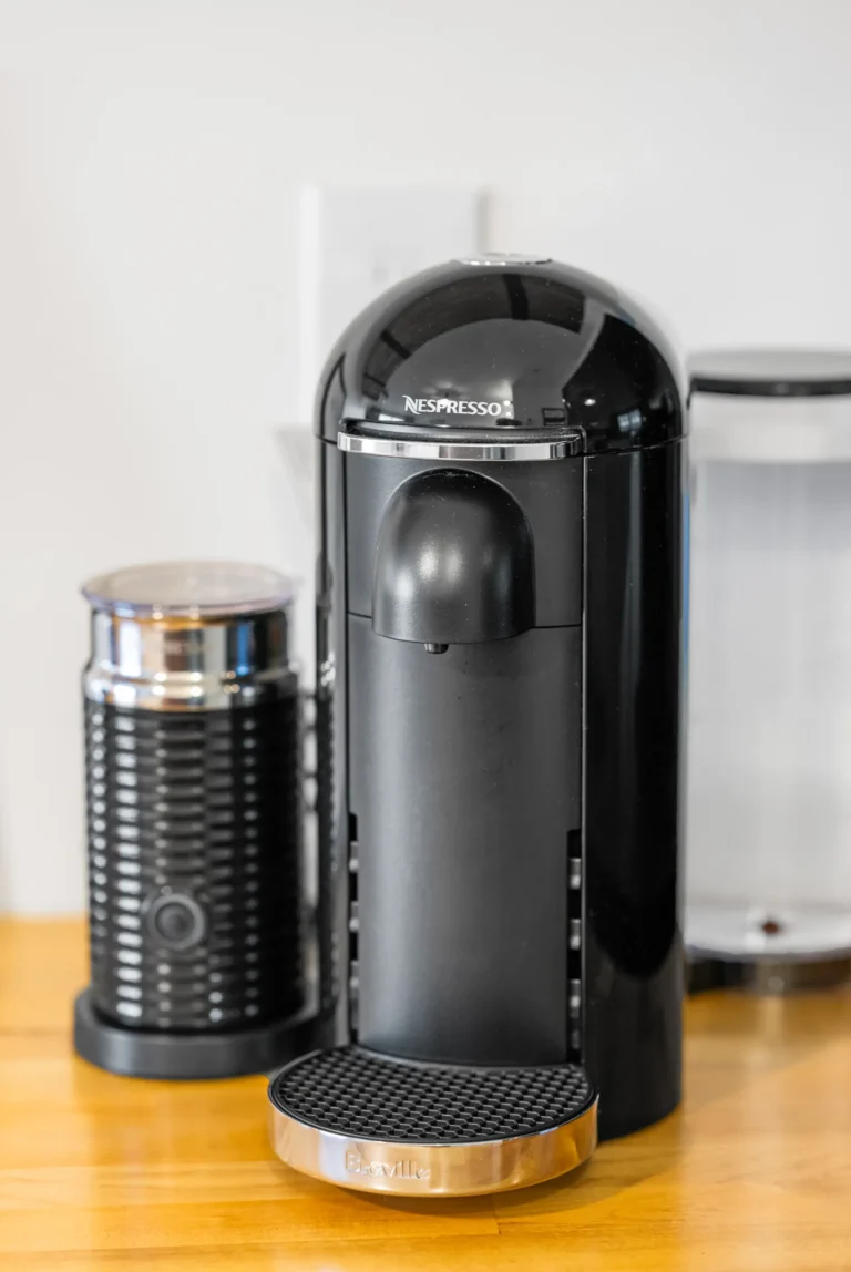 Black Nespresso coffee machine on kitchen counter