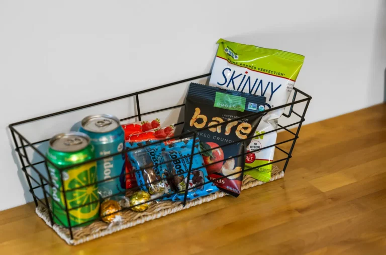 Wire basket with assorted snacks and drinks