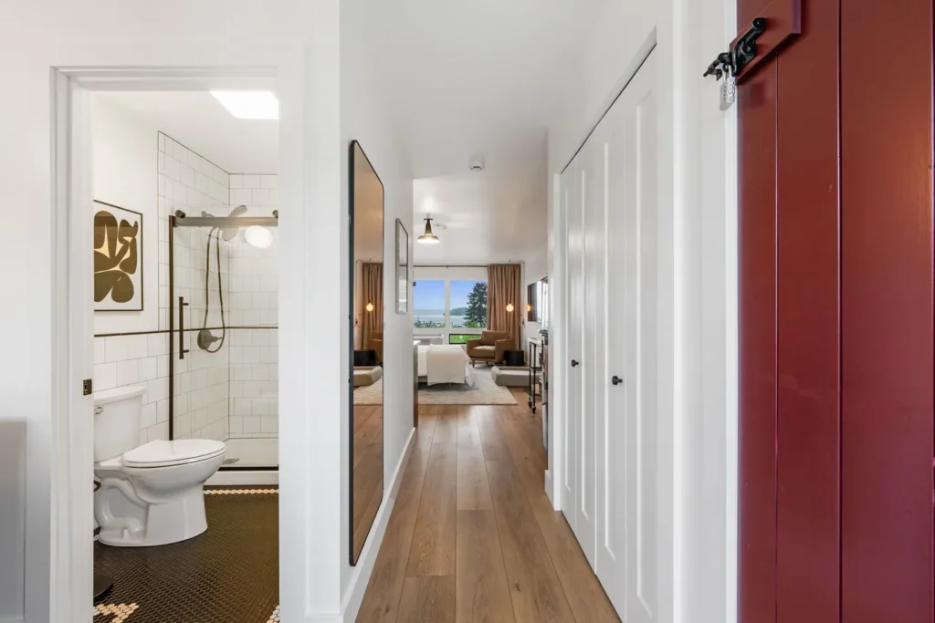 Modern hallway leading to living room and bathroom