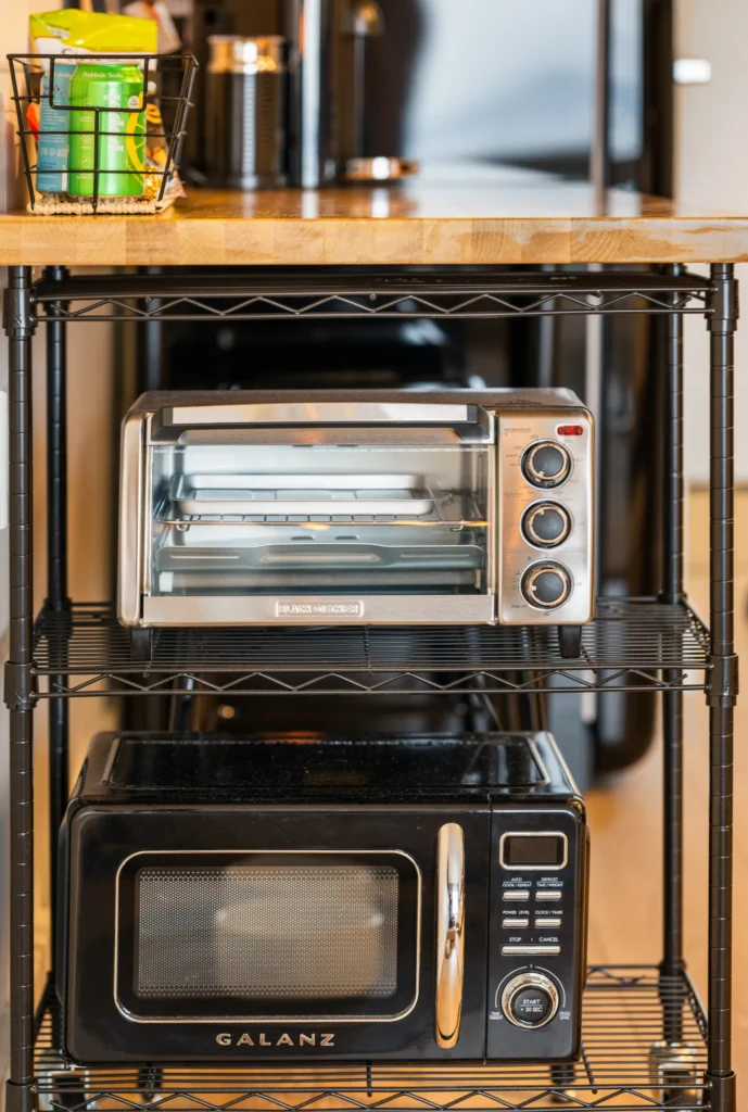 Kitchen shelf with toaster oven and microwave