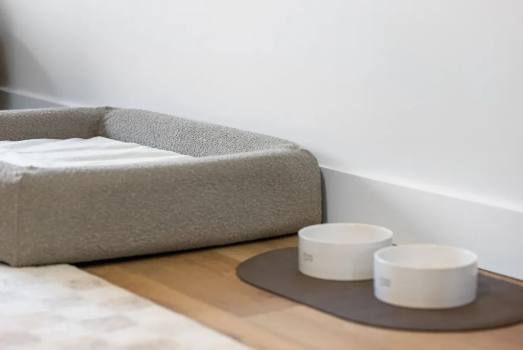 Dog bed with food and water bowls