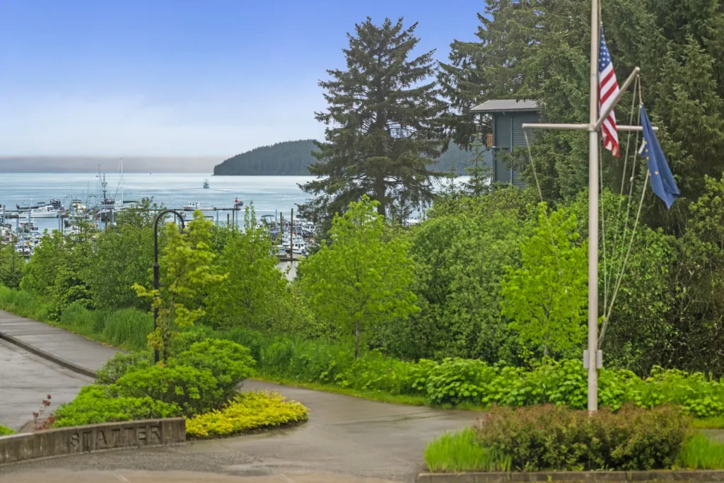 Scenic harbor view with boats and lush greenery