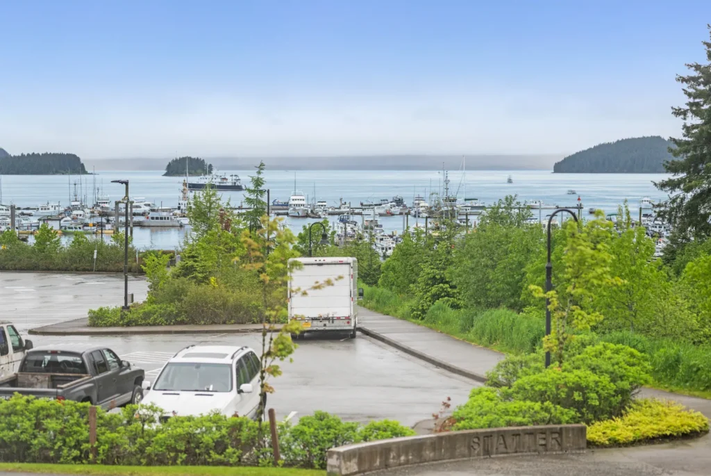 Scenic harbor view with boats and lush greenery