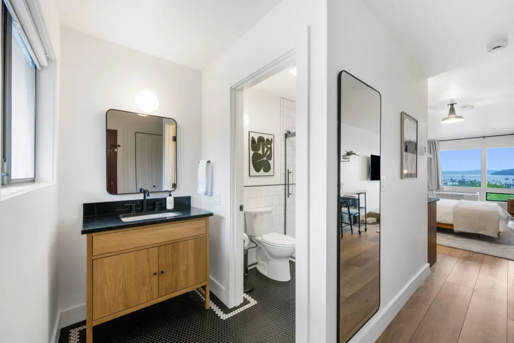 Modern bathroom and bedroom with ocean view