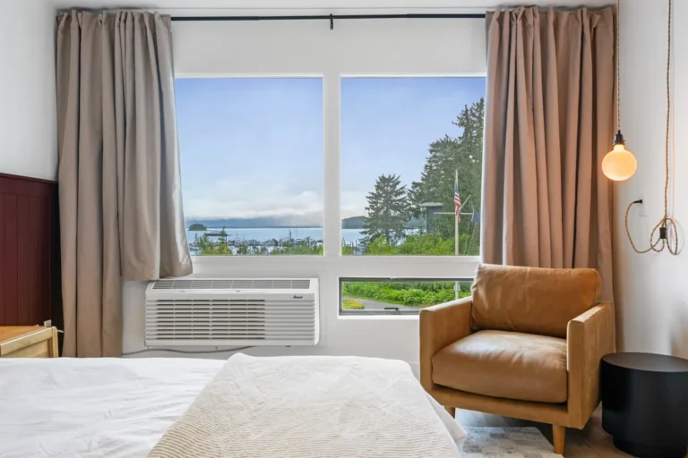Cozy bedroom with ocean view window