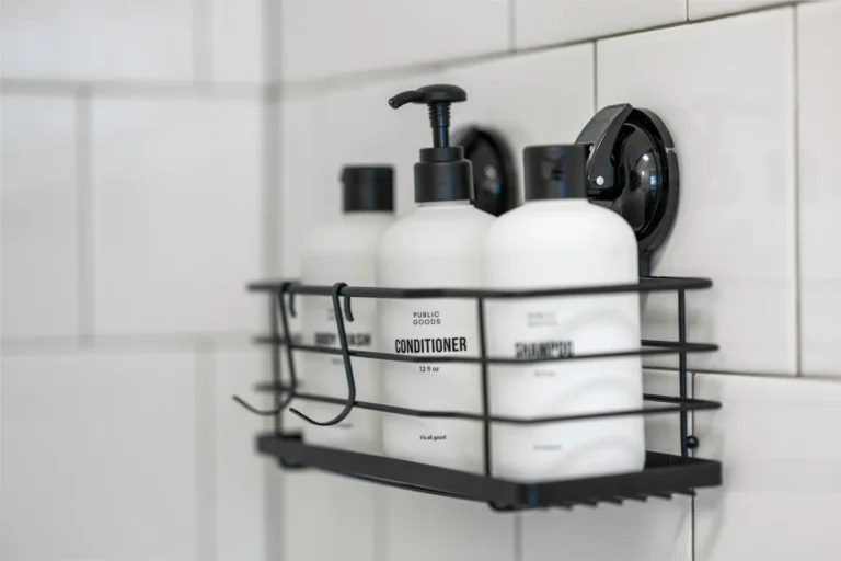 Shampoo and conditioner bottles on shower shelf