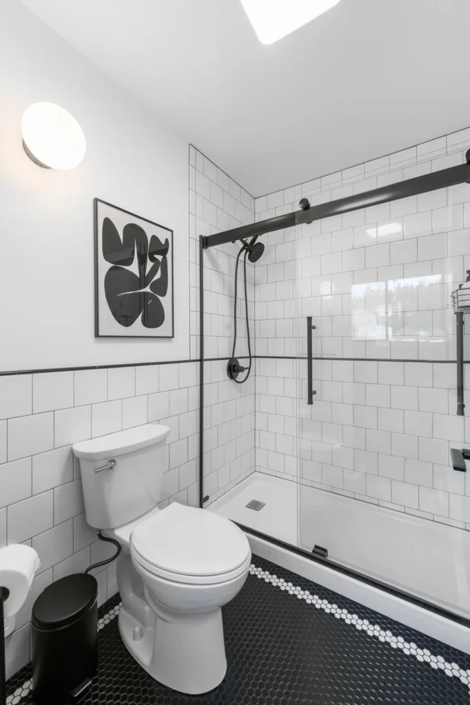 Modern bathroom with shower and white subway tiles