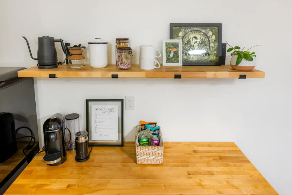 Modern coffee station with shelf and snacks