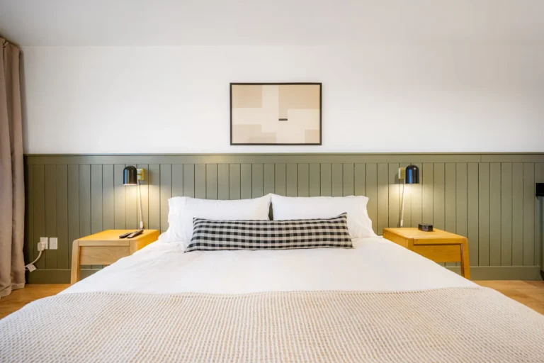 Modern bedroom with neatly made bed