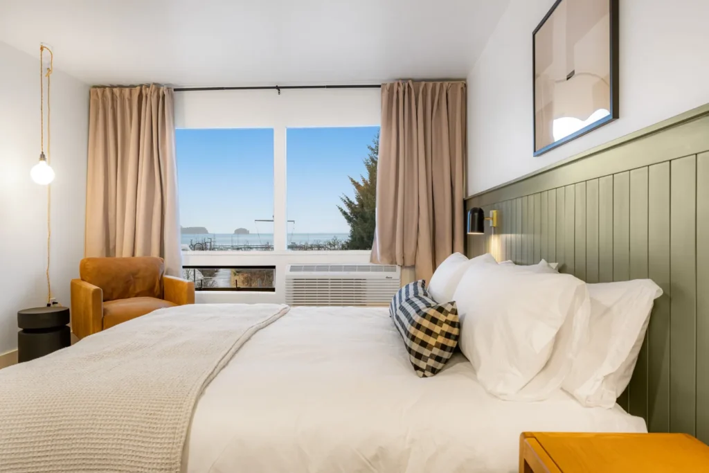 Cozy bedroom with ocean view window