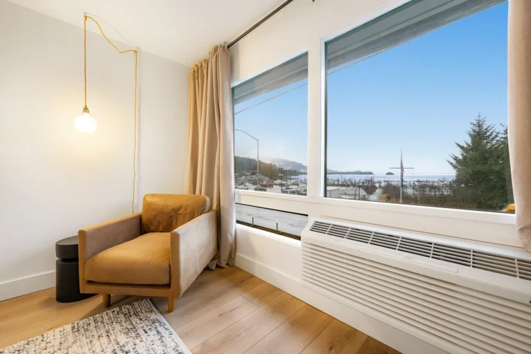 Cozy chair by window with ocean view