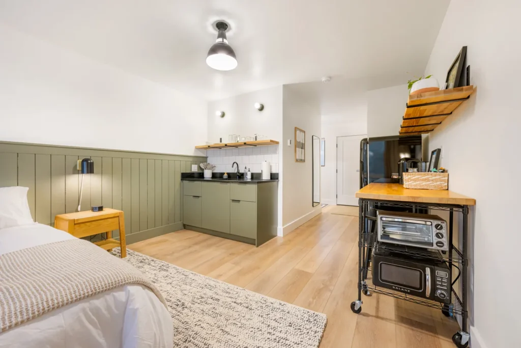 Modern studio with kitchenette and cozy bed