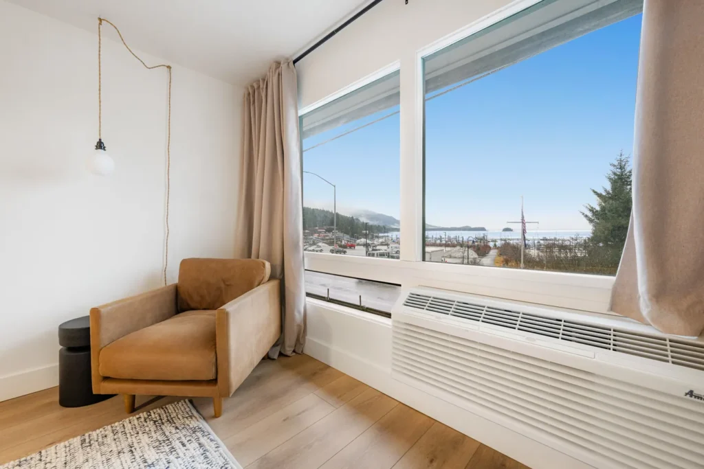 Cozy chair by window with ocean view