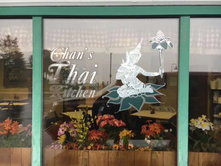 Chan's Thai Kitchen restaurant window with flowers